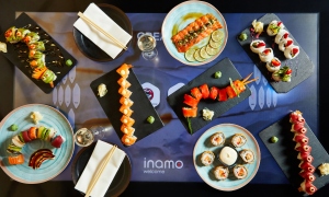 dishes on new touch tables in Covent Garden - inamo welcome screen beneath